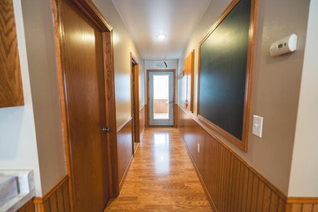 14656 Hersey Rd, Hersey, MI 49639 - corridor featuring light wood-style floors and wainscoting