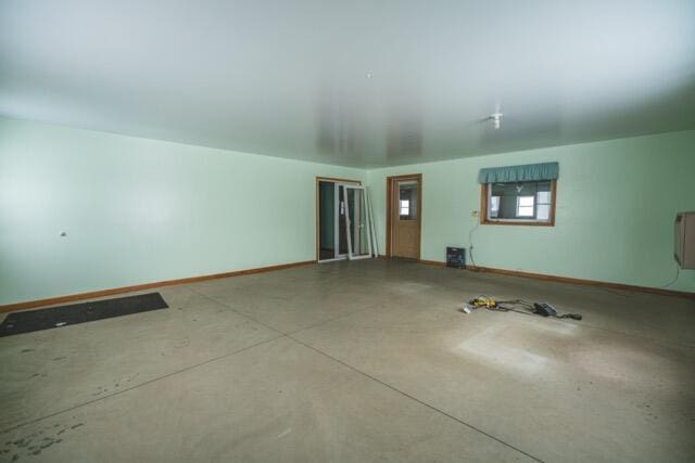 14656 Hersey Rd, Hersey, MI 49639 - spare room featuring baseboards and concrete flooring