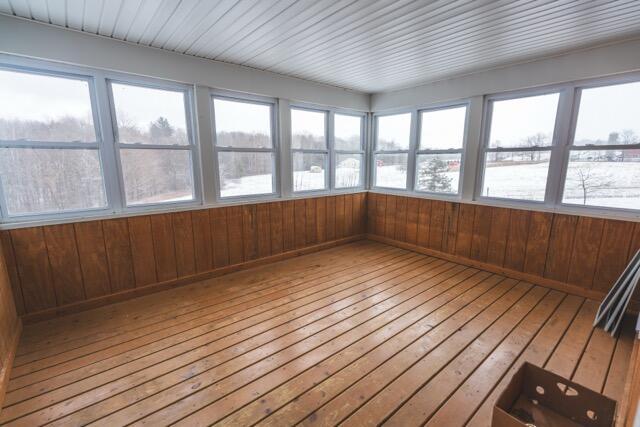 14656 Hersey Rd, Hersey, MI 49639 - unfurnished sunroom featuring hardwood / wood-style floors and wooden walls