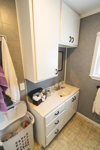 14656 Hersey Rd, Hersey, MI 49639 - bathroom featuring vanity, crown molding, and tile patterned floors