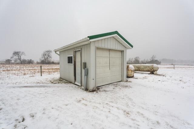 14656 Hersey Rd, Hersey, MI 49639 - snow covered garage with a garage