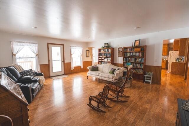 14656 Hersey Rd, Hersey, MI 49639 - living room featuring wainscoting and wood finished floors