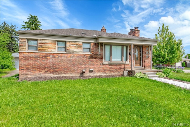26500 Grant St, Saint Clair Shores, MI 48081 - back of house featuring a yard, brick siding, and a chimney