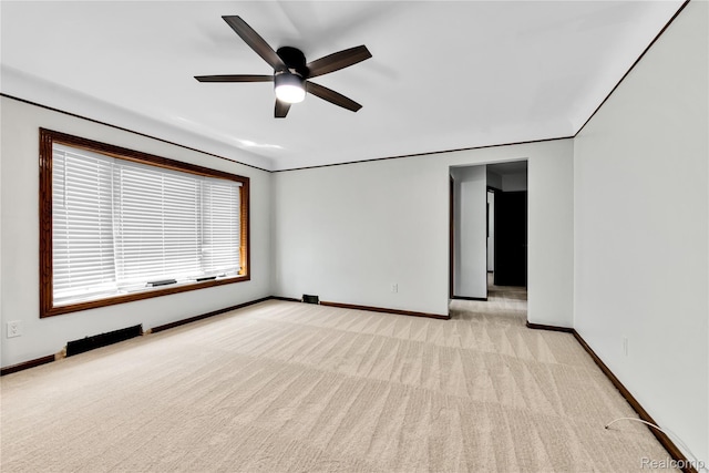 26500 Grant St, Saint Clair Shores, MI 48081 - spare room with light colored carpet, baseboards, and a ceiling fan