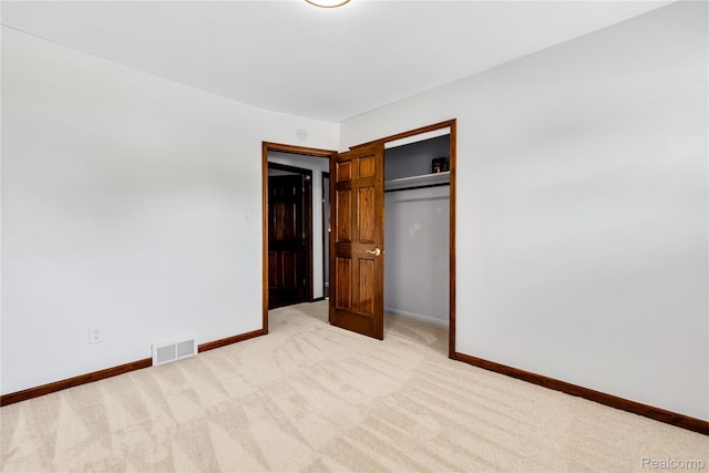 26500 Grant St, Saint Clair Shores, MI 48081 - unfurnished bedroom featuring light colored carpet, baseboards, and a closet