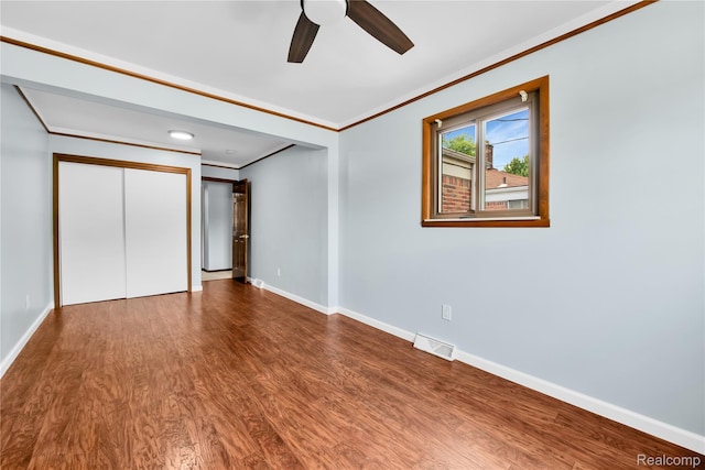 26500 Grant St, Saint Clair Shores, MI 48081 - unfurnished bedroom featuring ornamental molding, wood finished floors, baseboards, and ceiling fan