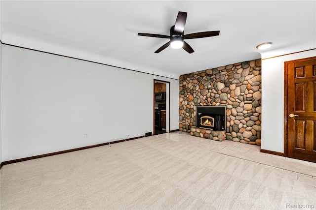 26500 Grant St, Saint Clair Shores, MI 48081 - unfurnished living room featuring carpet flooring, a ceiling fan, a fireplace, and baseboards