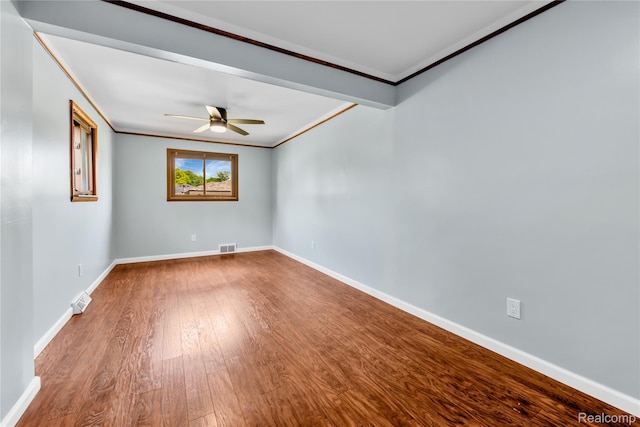26500 Grant St, Saint Clair Shores, MI 48081 - spare room with crown molding, ceiling fan, wood finished floors, and baseboards