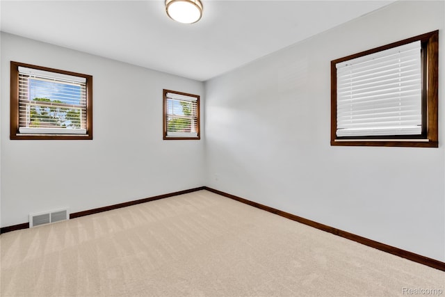 26500 Grant St, Saint Clair Shores, MI 48081 - unfurnished room featuring light carpet and baseboards