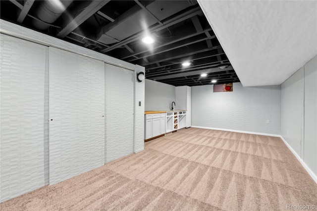 26500 Grant St, Saint Clair Shores, MI 48081 - finished below grade area with light carpet, baseboards, and a sink