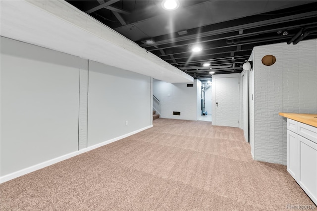 26500 Grant St, Saint Clair Shores, MI 48081 - finished below grade area with light carpet and stairs