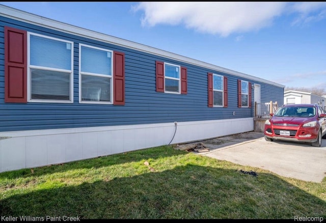 16196 Notre Dame, Clinton Township, MI 48038 - view of side of property featuring a lawn