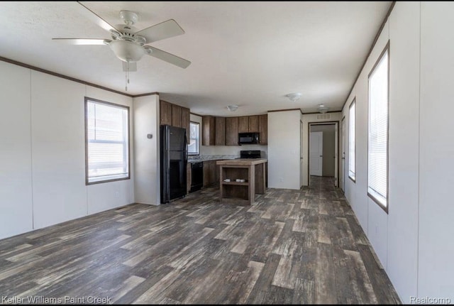 16196 Notre Dame, Clinton Township, MI 48038 - kitchen with black appliances, dark wood finished floors, ceiling fan, light countertops, and a center island