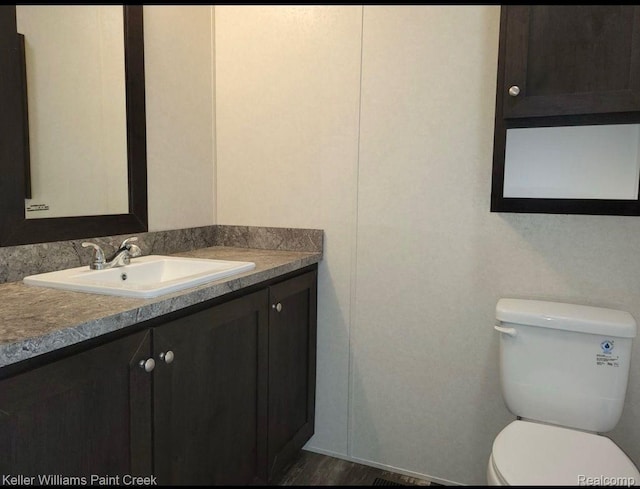 16196 Notre Dame, Clinton Township, MI 48038 - half bathroom with vanity and toilet