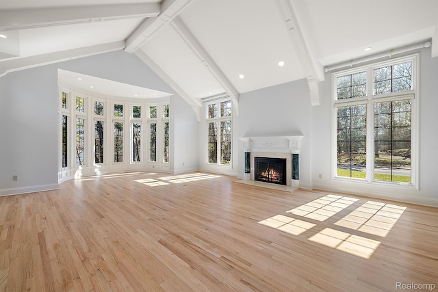 3013 Heron Pl, Bloomfield Hills, MI 48302 - unfurnished living room featuring high vaulted ceiling, a premium fireplace, beam ceiling, healthy amount of natural light, and light wood-type flooring