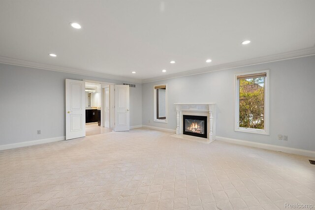 3013 Heron Pl, Bloomfield Hills, MI 48302 - unfurnished living room with ornamental molding, recessed lighting, a premium fireplace, baseboards, and light colored carpet