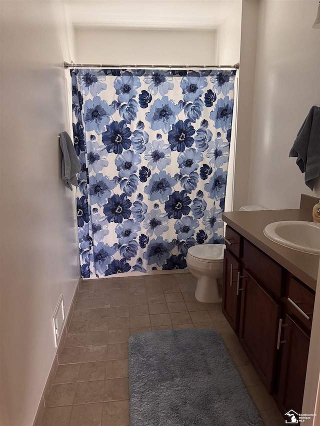 2446 8th St, Wyandotte, MI 48192 - bathroom with tile patterned floors, vanity, toilet, and a shower with curtain