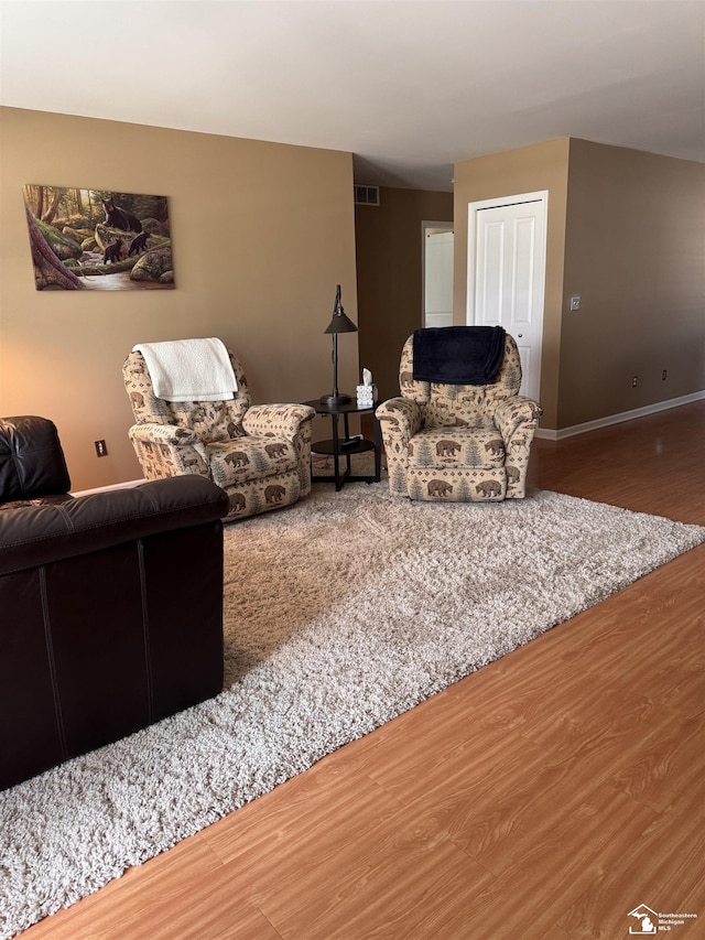 2446 8th St, Wyandotte, MI 48192 - living room featuring wood finished floors and baseboards
