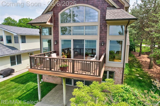 15496 Bealfred Dr, Fenton, MI 48430 - back of property with roof with shingles, a yard, a deck, and brick siding