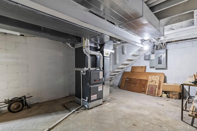 2995 Venice, Highland, MI 48356 - unfinished basement featuring electric panel, stairway, and heating unit