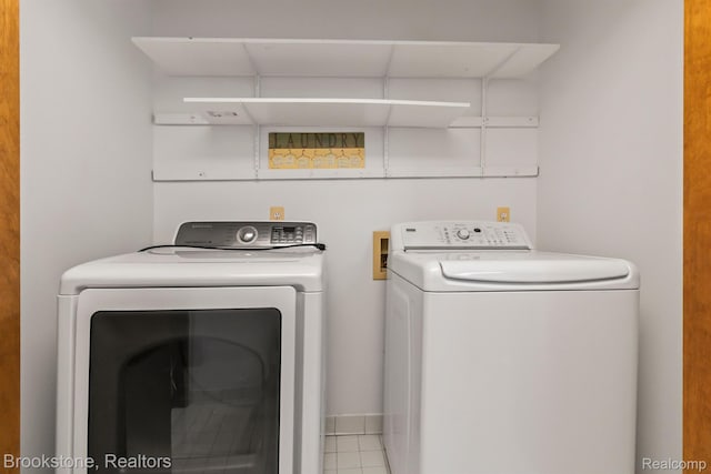 2995 Venice, Highland, MI 48356 - laundry area with washer and dryer and tile patterned floors