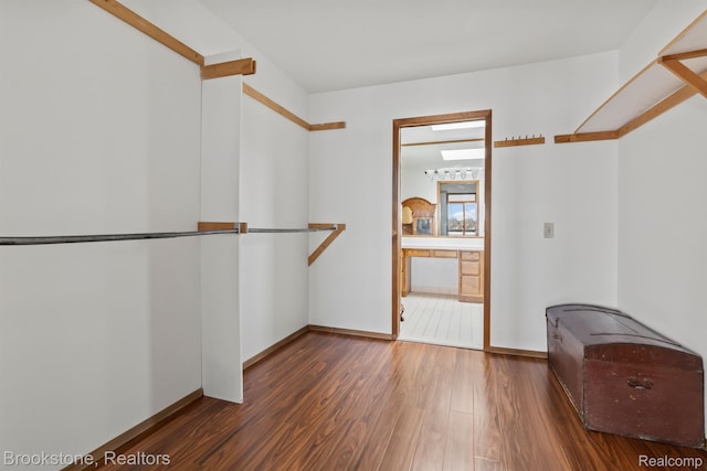 2995 Venice, Highland, MI 48356 - walk in closet with wood finished floors