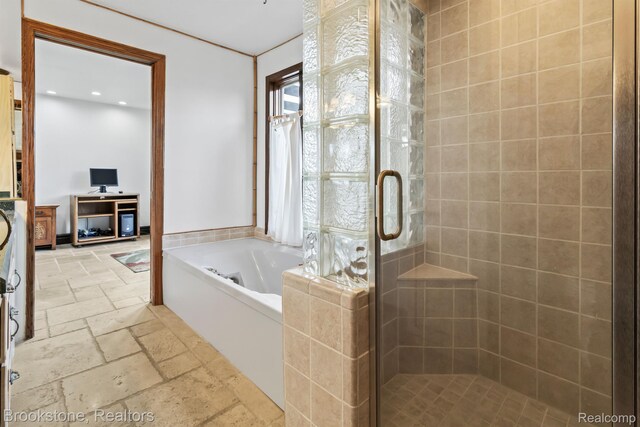 2995 Venice, Highland, MI 48356 - full bathroom featuring stone tile floors, a bath, a shower stall, and recessed lighting
