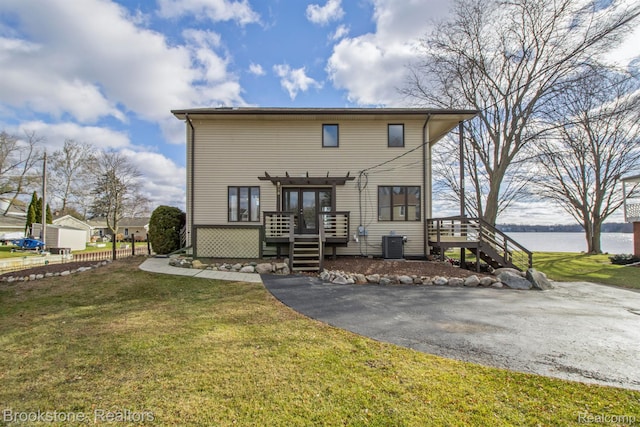 2995 Venice, Highland, MI 48356 - back of house with stairs, a deck with water view, cooling unit, and a lawn