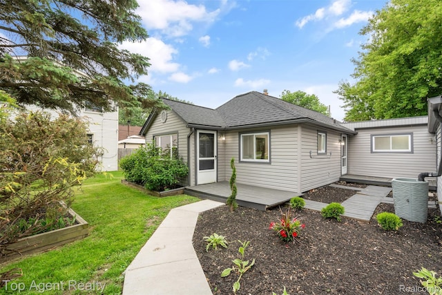 38479 Albert Blvd, Clinton Township, MI 48036 - view of front facade featuring a garden, a deck, a front lawn, and a shingled roof