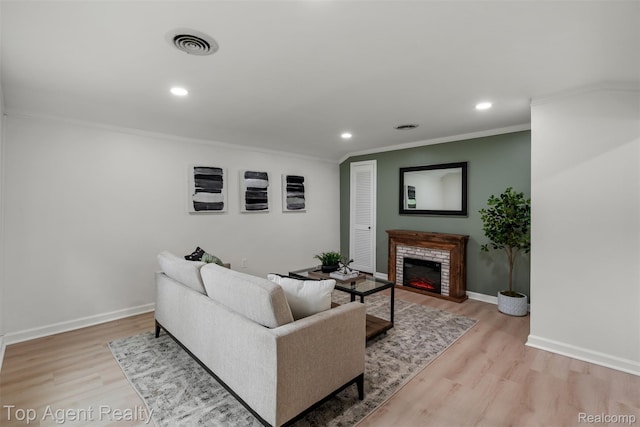 38479 Albert Blvd, Clinton Township, MI 48036 - living room featuring crown molding, wood finished floors, a warm lit fireplace, recessed lighting, and baseboards