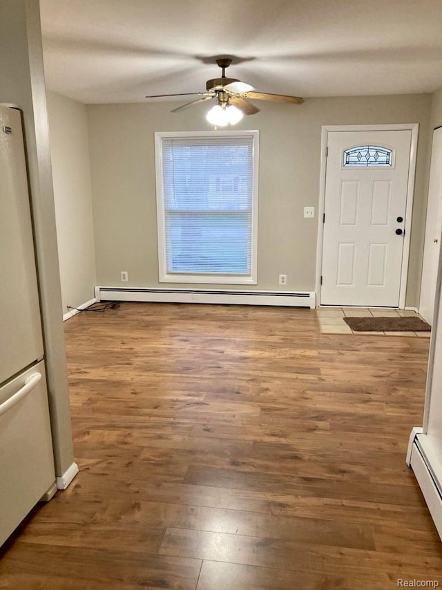 630 Aldrich St, Linden, MI 48451 - entryway with a baseboard radiator, a ceiling fan, and wood finished floors