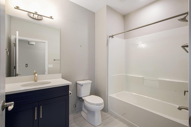 603 Woodland, Dexter, MI 48130 - bathroom featuring toilet, vanity, shower / bath combination, and baseboards