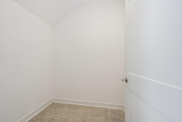 603 Woodland, Dexter, MI 48130 - spare room with light carpet, lofted ceiling, and baseboards