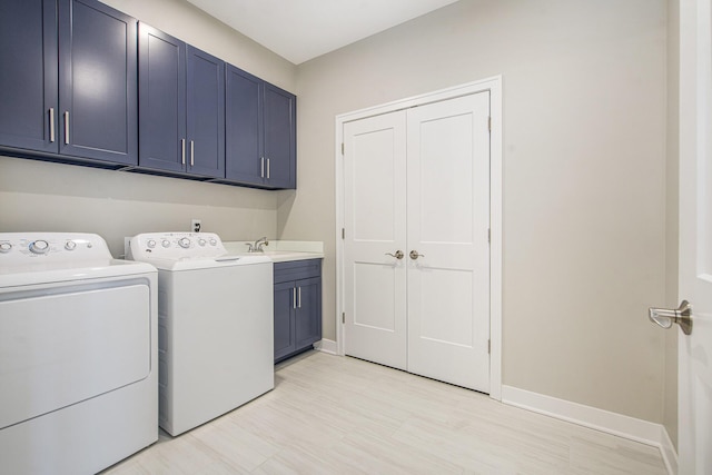 603 Woodland, Dexter, MI 48130 - laundry area featuring cabinet space, independent washer and dryer, and baseboards