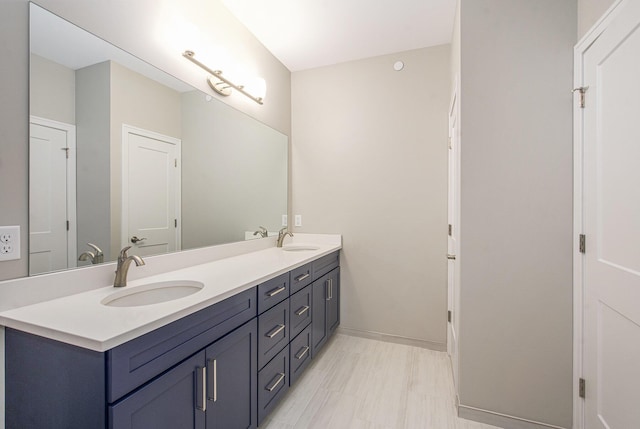 603 Woodland, Dexter, MI 48130 - full bathroom with double vanity and baseboards