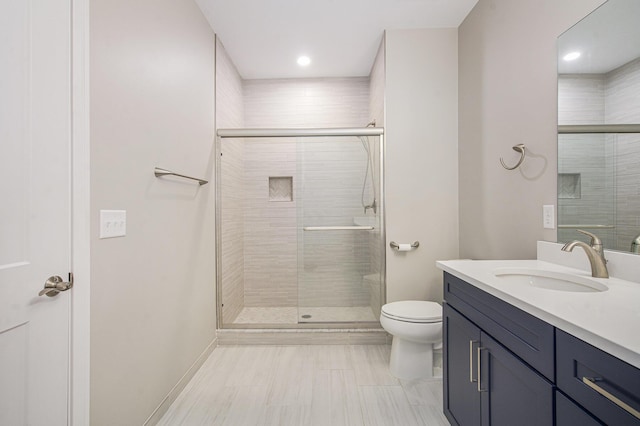 603 Woodland, Dexter, MI 48130 - full bathroom featuring vanity, toilet, a stall shower, and recessed lighting