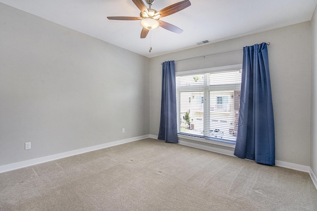 603 Woodland, Dexter, MI 48130 - carpeted spare room with baseboards and ceiling fan
