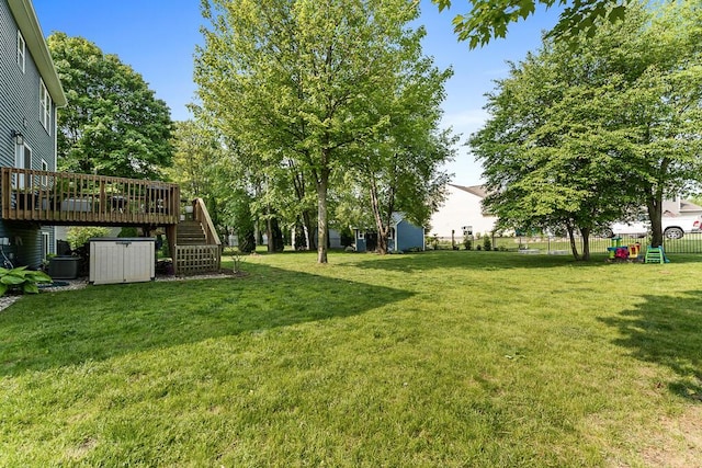 5855 Larson Ln, Muskegon, MI 49444 - view of yard with stairway, a deck, and central AC unit