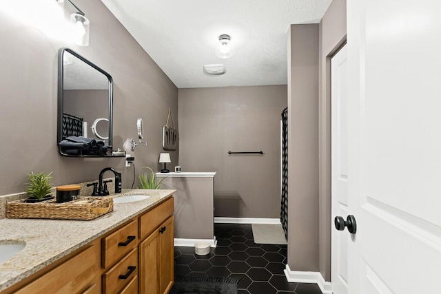 5855 Larson Ln, Muskegon, MI 49444 - bathroom with double vanity, baseboards, tile patterned flooring, and a shower with curtain