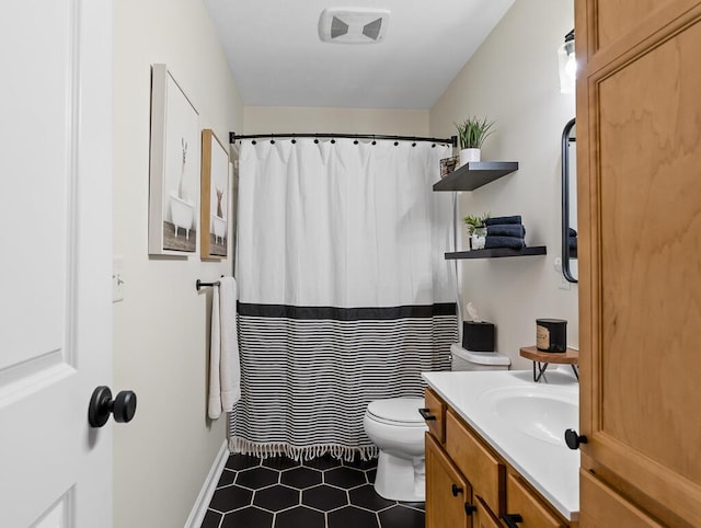 5855 Larson Ln, Muskegon, MI 49444 - full bathroom featuring toilet, vanity, tile patterned floors, and curtained shower
