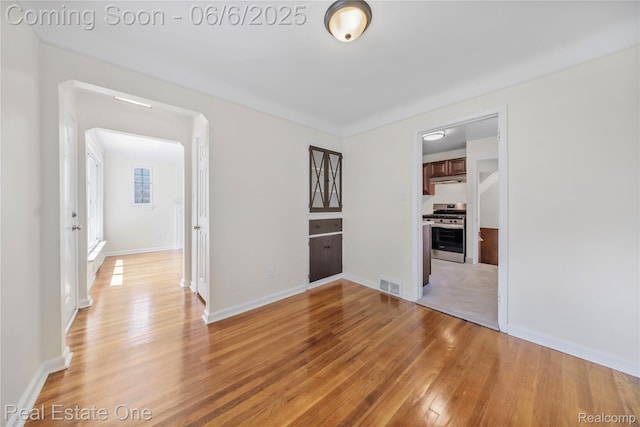 21167 Lancaster St, Grosse Pointe Woods, MI 48225 - spare room with light wood-type flooring and baseboards