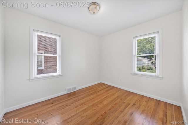 21167 Lancaster St, Grosse Pointe Woods, MI 48225 - empty room with baseboards and wood finished floors