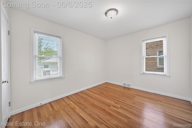 21167 Lancaster St, Grosse Pointe Woods, MI 48225 - spare room featuring baseboards and wood finished floors