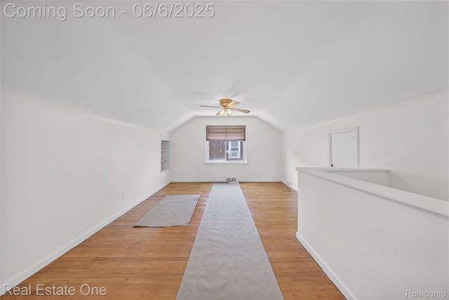 21167 Lancaster St, Grosse Pointe Woods, MI 48225 - additional living space featuring lofted ceiling, baseboards, built in features, a ceiling fan, and light wood-type flooring
