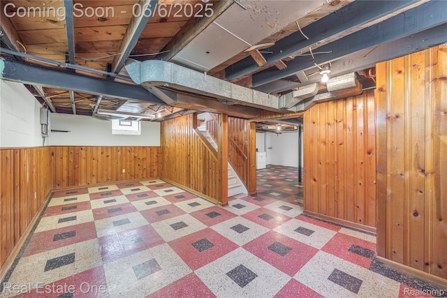 21167 Lancaster St, Grosse Pointe Woods, MI 48225 - below grade area with tile patterned floors, wooden walls, and stairway