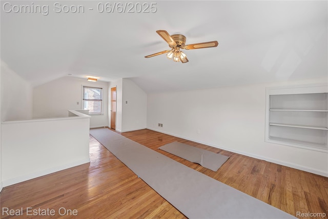 21167 Lancaster St, Grosse Pointe Woods, MI 48225 - bonus room featuring built in shelves, lofted ceiling, baseboards, a ceiling fan, and wood finished floors