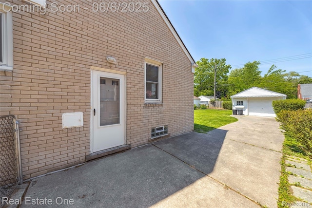 21167 Lancaster St, Grosse Pointe Woods, MI 48225 - doorway to property with brick siding, driveway, a detached garage, and a patio area