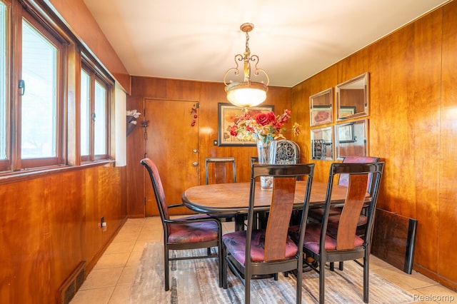 19419 Coral Gables St, Southfield, MI 48076 - dining space featuring light tile patterned flooring and wood walls