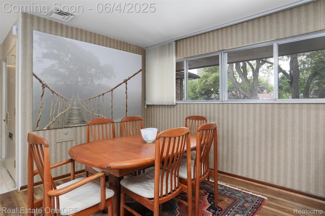 439 Barclay Rd, Grosse Pointe Farms, MI 48236 - dining space with wallpapered walls, wood finished floors, and baseboards
