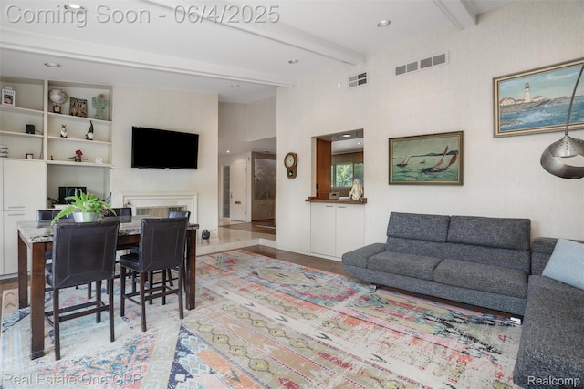 439 Barclay Rd, Grosse Pointe Farms, MI 48236 - living area with beamed ceiling, a fireplace, and wood finished floors